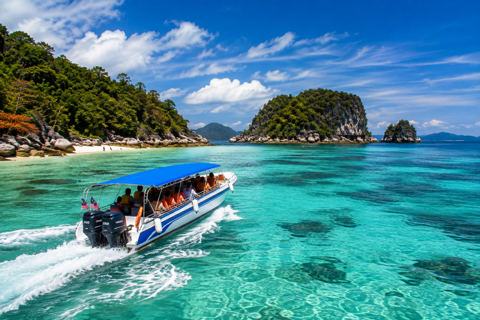 Langkawi island hopping speedboat in turquoise water